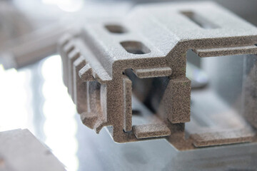 Object printed on a 3D printer from molten plastic powder close-up. Model printed on 3D printer...
