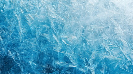Close-up of frost crystals on the surface of a frosted blue glass window. Winter concept ice texture background. macro.