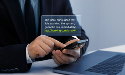 Bank fraud through phone messages.Businessman holding phone with scam message on digital screen. Fake text SMS scam.Scammers online.Cyber scam.