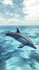 A dolphin swimming gracefully in clear blue ocean waters under a bright sky.