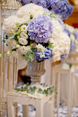 luxury color theme wedding solemnisation dinner flower florist , dinnerware banquet, cloth and stage lighting decoration design in premium hotel ballroom and beautiful beach event