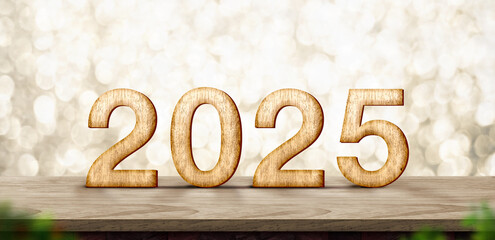 2025  happy new year wood number (3d rendering) on wood table with sparkling gold bokeh wall,leave...