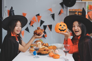 friendship, holiday and people concept - group of happy smiling friends in halloween costumes of...