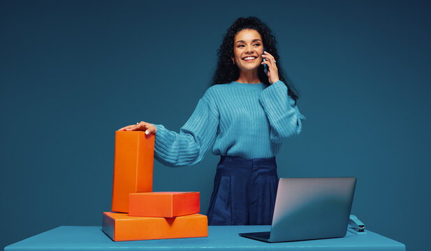 Female agent negotiating sales deals with orange color blocking elements