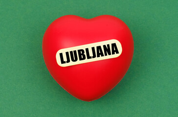 A vibrant red heart with Ljubljana written on it captures the essence of love for the capital city, celebrating its charm and allure