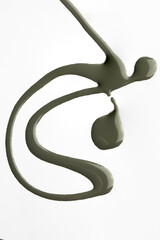 Artistic nail polish brush stroke, lacquer smear in green at white background , catalogue style