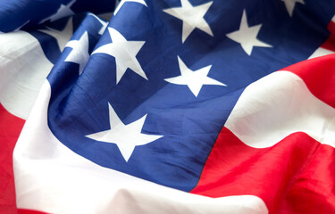 Close up of ruffled American flag. Satin texture curved flag of USA. Memorial Day or 4th of July....