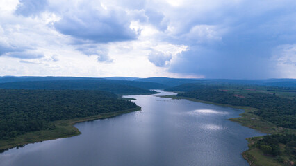 Drone shot. Aerial view scenic landscape of a large river delta amid a lush forest at the tropical...
