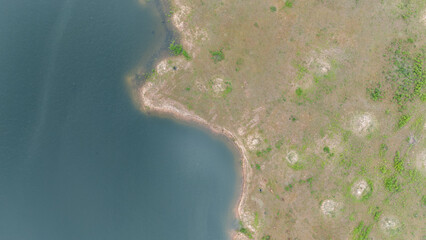 Drone shot. Aerial view scenic landscape of a large river delta amid a lush forest at the tropical...