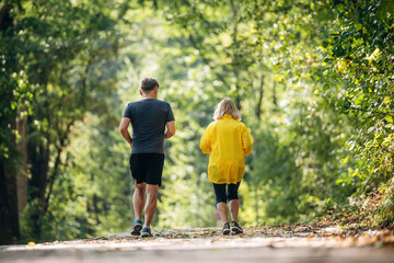 Obraz premium Casual jogging, sport conception. Senior couple together outdoors at nature