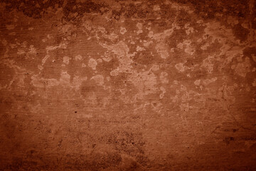 Dark brown rough grainy stone or concrete wall texture background