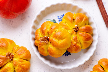 Pumpkin-shaped buns with apple and pumpkin filling.