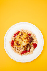 fried cod fish with white beans and grilled red pepper