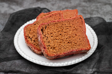beet red bread on white small plate