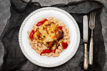fried cod fish with white beans and grilled red pepper