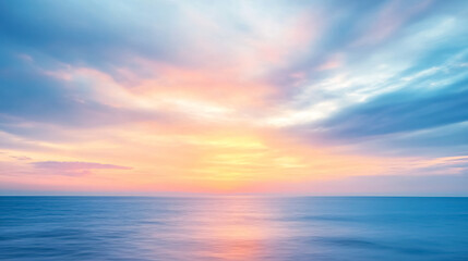 Fototapeta premium Abstract Blurred Sunrise Sky and Ocean Nature Background: An abstract image featuring a blurred sunrise sky over the ocean, creating a dreamy and serene background.