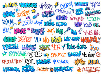 Spray-painted lettering fills the wall with diverse messages that reflect urban culture, creativity, and a lively spirit in the streets © WinWin