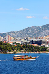 Contemporary buildings, gardens and beaches at the waterfront in Split, Croatia. View of Split from the boat.