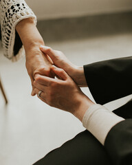 Grandmother and granddaughter holding hands. Two family generations together. Family love, closenes