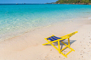 Serene Tropical Beach with Vibrant Beach Chair