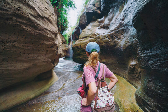Tourist is looking at canyon in the Hells Gate National Park, Kenya