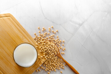 Top shot soy milk and soybeans on marble surface