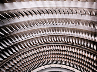Close-up of titanium turbine blades, jet engine © Mek Yerku