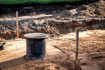 Sewer well and pipes, underground communications. Street repair