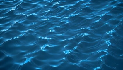 Obraz premium Rippling blue water surface with light reflections, creating a dynamic and abstract pattern