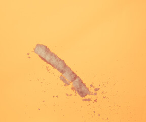 Winter snow falling flying over sunset evening orange sky. Snow dust falling throwing in sunlight sunset on orange evening, yellow background isolated