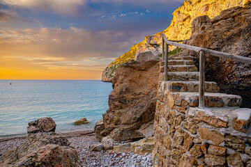 The Granadella cove with crystal-clear waters in Javea, Alicante, in the Spanish Mediterranean