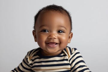 Smiling baby with striped shirt showing first teeth against white background Generative AI