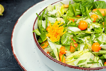 Salad from wild plants and physalis.