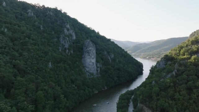 4K Romania Rock Sculpture of Decebalus close up slow track to reveal river