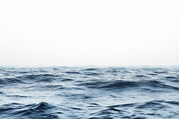 White background. Movement. Close-up view of water's surface.