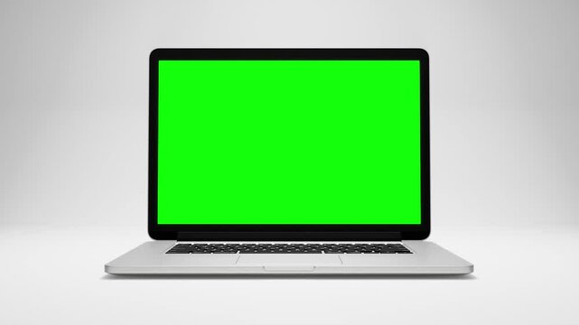 3d rendering of a laptop opening and showing green screen on white background