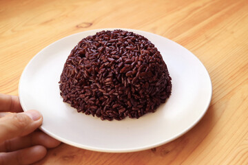Plate of Freshly Cooked Riceberry Rice, a Medium to Low Glycemic Index Carb with Numerous Health Benefits