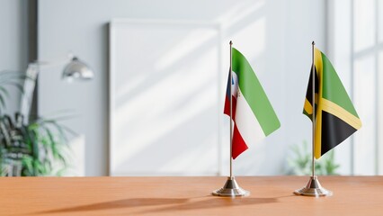 FLAGS OF EQUATORIAL GUINEA AND JAMAICA ON TABLE