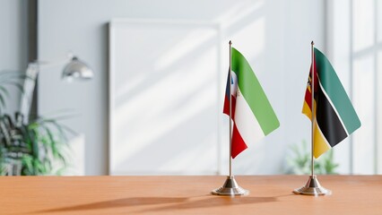 FLAGS OF EQUATORIAL GUINEA AND MOZAMBIQUE ON TABLE