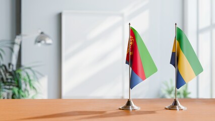 FLAGS OF ERITREA AND GABON ON TABLE