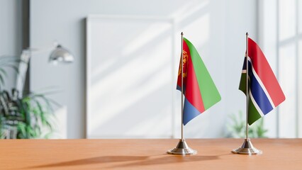 FLAGS OF ERITREA AND GAMBIA ON TABLE