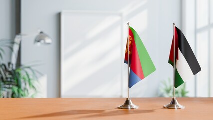 FLAGS OF ERITREA AND JORDAN ON TABLE