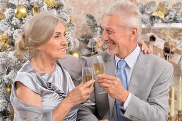 couple old and mature seniors enjoying and having fun together celebrating the new year 