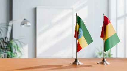 FLAGS OF ETHIOPIA AND GUINEA ON TABLE