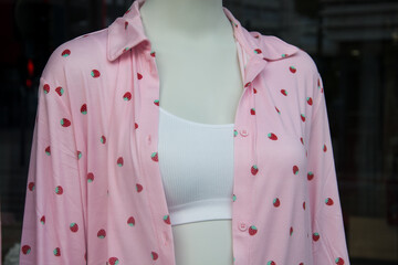 closeup of pink pajama for women with printed strawberries for  fashion store showroom