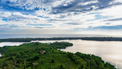 Scenic view of a lush Sri Lankan coastline at dawn. A tranquil dawn unveils the lush Sri Lankan...