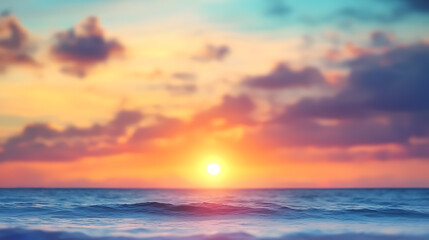 Obraz premium Blurred Defocused Sunset Sky and Ocean Nature Background: An abstract background featuring a blurred sunset sky over the ocean, creating a soft and dreamy effect.