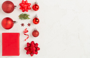 Handmade wrapped christmas gift boxes with stuff on concrete background, top view