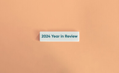 2024 Year in Review. Text on Block Letter Tiles on Dusty Pink Background. Minimal Aesthetic.