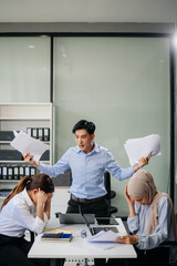 Furious team Asian businesspeople arguing strongly after making a mistake at work in office